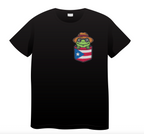 “Black T-shirt with a green Coquí frog wearing a straw hat above a Puerto Rico flag pocket-style chest design.”